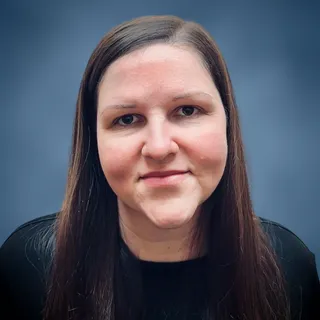 Angela Davidson, Case and Office Manager at Brant Hickey Orlando, smiling at the camera